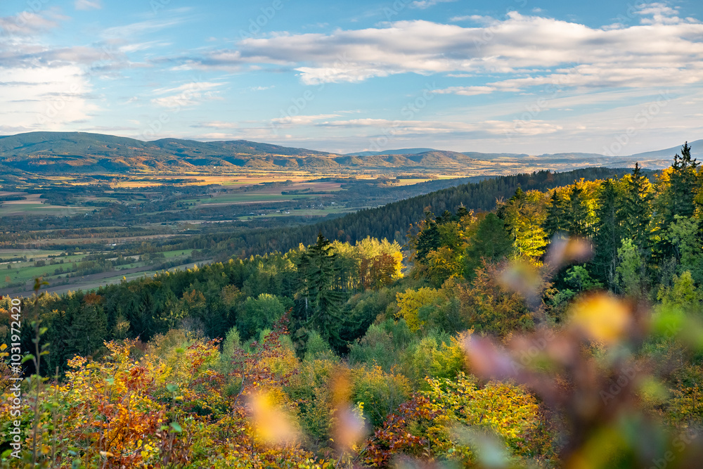 Bystrzyckie Mountains in the Western Sudetes, mountain landscape in autumn, view of the valley from the hiking trail in the late evening.