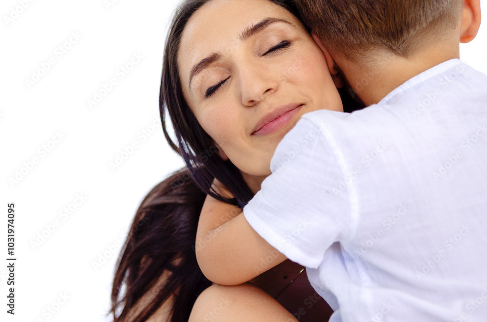 Close-up portrait of smiling woman hugging little boy. Charming mom and her child in white casual clothes. Embraces of young attractive brunette and her cute son. Close-up portrait of smiling woman hugging little boy. Charming mom and her child in white casual clothes. Embraces of young attractive brunette and her cute son.