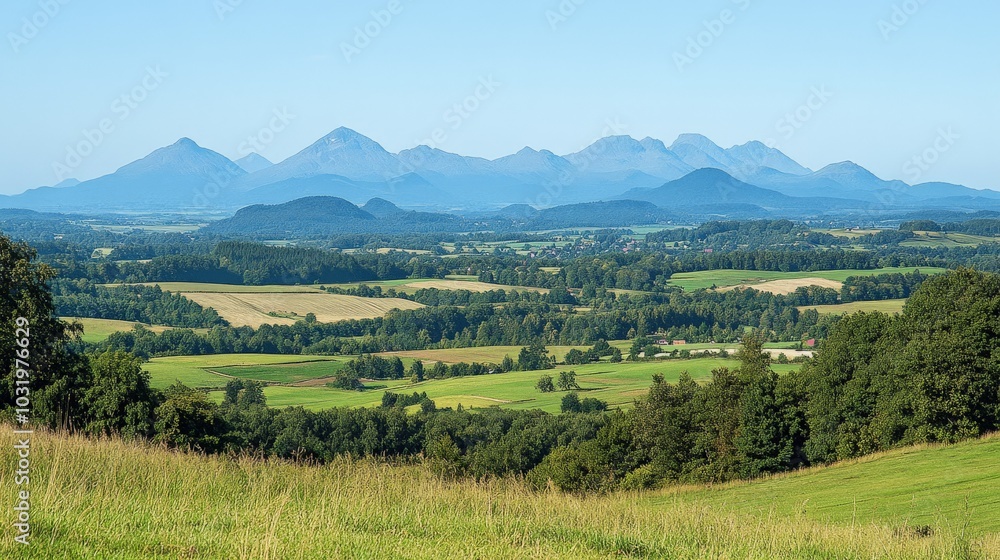Obraz premium Picturesque Mountain Landscape with Rolling Hills and Meadows