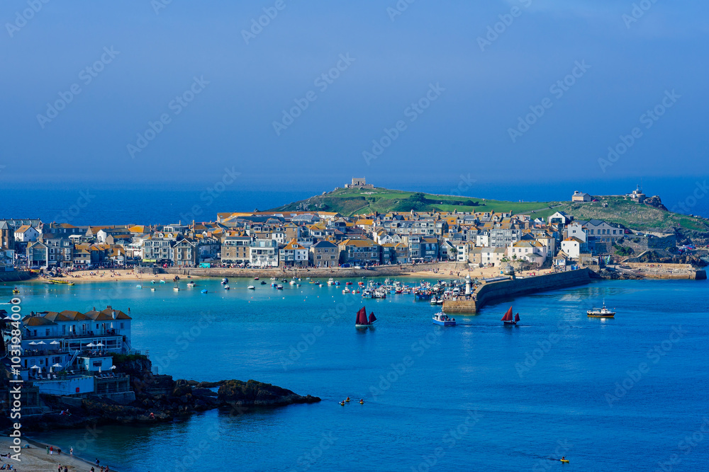 Late afternoon sun lights up the town of St Ives, Cornwall in September. Late afternoon sun lights up the town of St Ives, Cornwall in September.