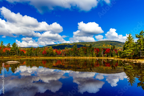 Tranquil Autumn Lake with Vibrant Fall Foliage Reflections