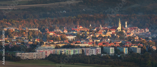 Obraz na płótnie Bystrzyca Klodzka, a small town in a mountain valley, a view of the city's buildings from the hiking trail in the Bystrzyckie Mountains. Landscape in the evening. w salonie