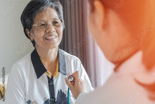 Obraz na płótnie Elderly patient heart health check by medical geriatric doctor for awareness in