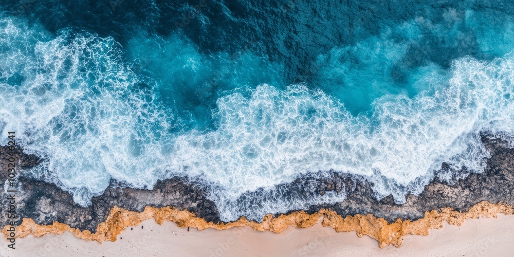 Obraz premium Bird's-eye view of a remote coastline, with waves crashing against jagged cliffs and a lighthouse standing guard above the ocean.
