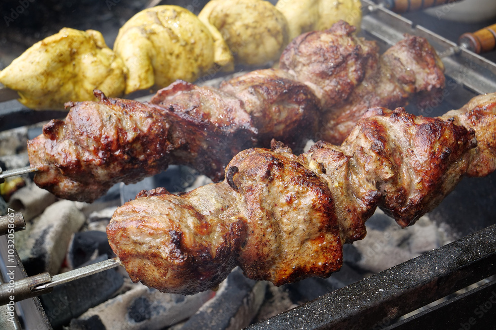 Grilled meat. Shish kebabs broils in barbecue Grilled meat. Shish kebabs broils in barbecue