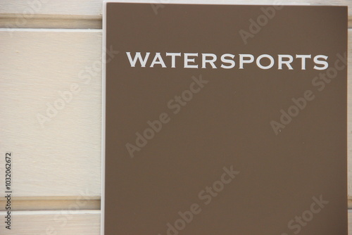 Entrance of a watersport centre with the sign on the wall