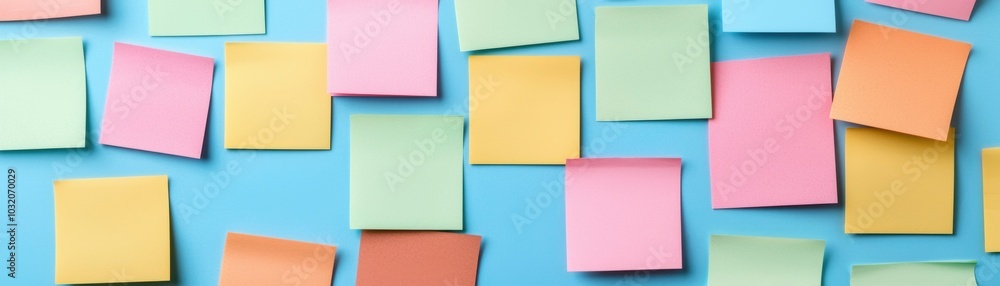 Colorful sticky notes arranged on a blue background Colorful sticky notes arranged on a blue background