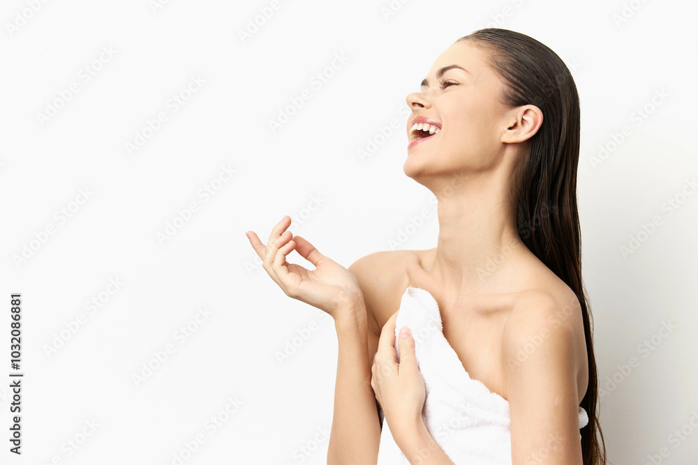Happy young woman laughing joyfully with a towel, bright white background, emphasizing freshness and beauty, capturing a moment of carefree happiness Happy young woman laughing joyfully with a towel, bright white background, emphasizing freshness and beauty, capturing a moment of carefree happiness