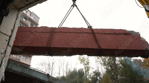 Crane Lifting Cut Concrete Panel. Construction and Heavy Lifting