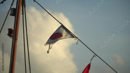 japanese flag on the rope of a boat