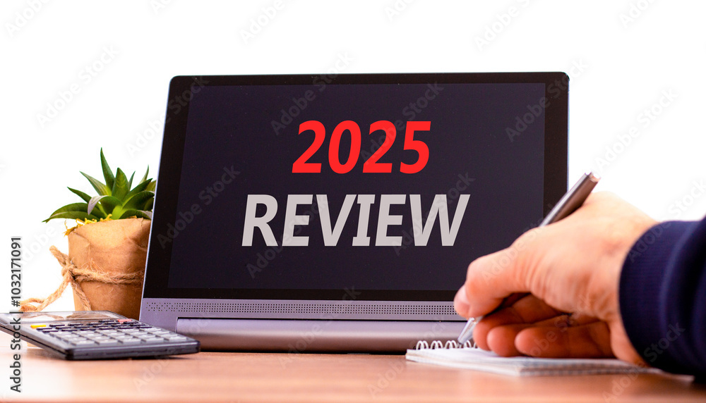 Planning 2025 review new year symbol. Concept words 2025 Review on beautiful black tablet. Beautiful white background. Businessman hand. Business 2025 review new year concept. Copy space. Planning 2025 review new year symbol. Concept words 2025 Review on beautiful black tablet. Beautiful white background. Businessman hand. Business 2025 review new year concept. Copy space.