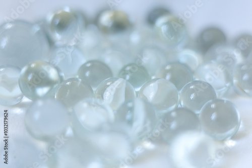 clear Glass marbles on a white background, close-up, selective focus