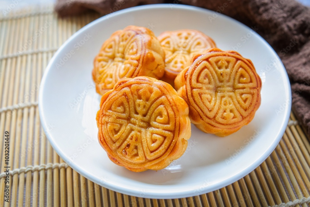 Moon cake in white plate ,chinese style,Mid-Autumn Festival Moon cake in white plate ,chinese style,Mid-Autumn Festival