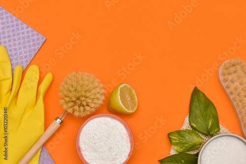 Top view of cleaning concept with eco friendly cleaning elements and zero waste on orange background photo