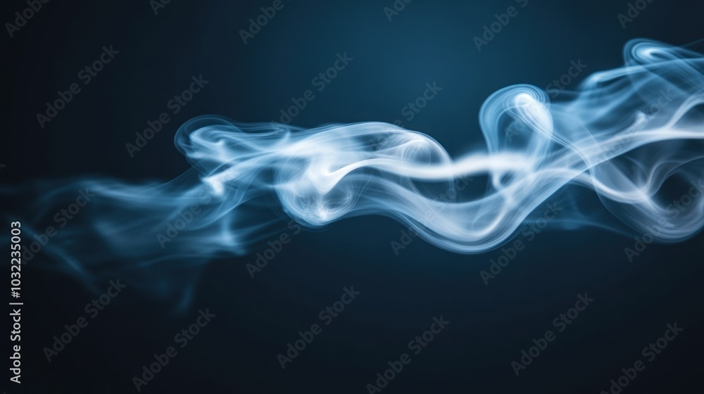 Fototapeta premium Abstract blue smoke swirls against a dark background.