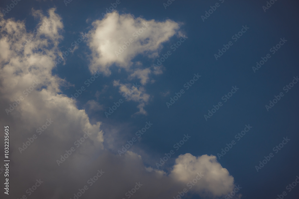 White heap clouds in the blue peaceful sky. The concept of psychological calmness and health. Peace of mind with the forces of nature. Air travel concept. White heap clouds in the blue peaceful sky. The concept of psychological calmness and health. Peace of mind with the forces of nature. Air travel concept.