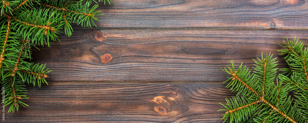Christmas gray wooden background with fir tree and copy space. top view empty space for your design Christmas gray wooden background with fir tree and copy space. top view empty space for your design