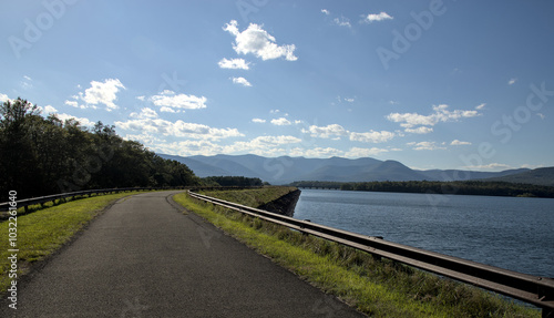 ashokan reservoir promenade surface next to large pond body of water and catskills mountains in the background (public park leisure, walking biking path trail) sunny day travel hudson valley new york photo