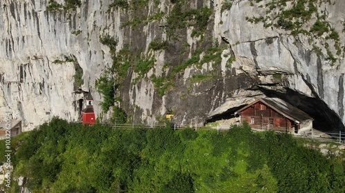 Famous mountain guesthouse Aescher at Ebenalp in the middle of the hiking trail of the Swiss alps