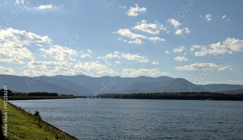 view of the catskills mountains with ashokan reservoir in the foreground on a bright sunny day in the summer (hudson valley catskill hills) scenic travel destination upstate new york lake pond photo