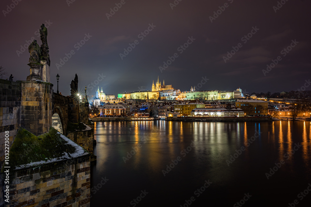 A stunning nighttime view of Charles Bridge with Prague Castle illuminated in the background. A stunning nighttime view of Charles Bridge with Prague Castle illuminated in the background.