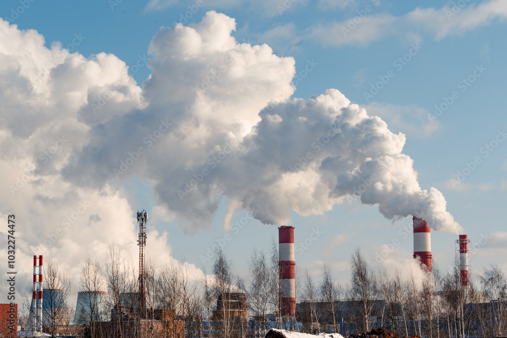 Emissions of harmful substances into the atmosphere. Air pollution from heating station a natural gas and coal power plant. Ecological concept.