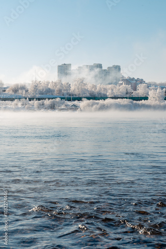 Winter frosty evaporation from the river in cold weather.