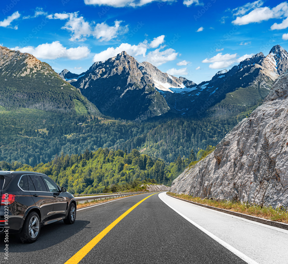 The car is driving along the highway surrounded by picturesque nature. The car is driving along the highway surrounded by picturesque nature.