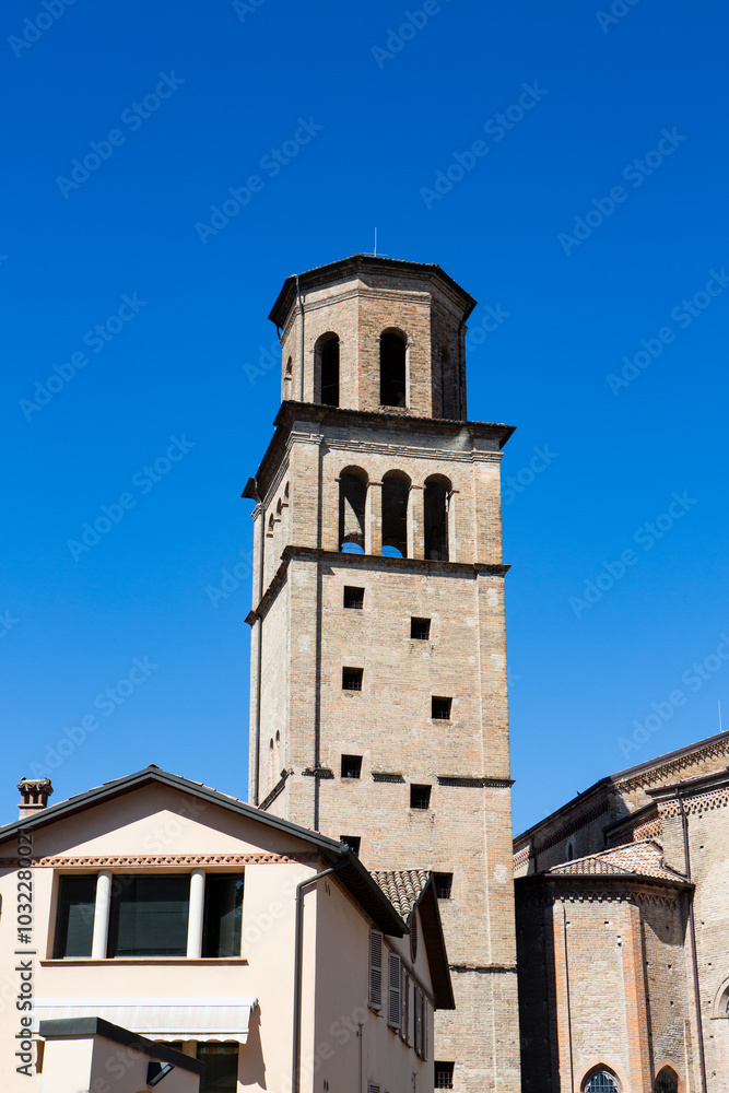 Urban landscape of Parma showing alley and cathedral's famous bell tower Urban landscape of Parma showing alley and cathedral's famous bell tower