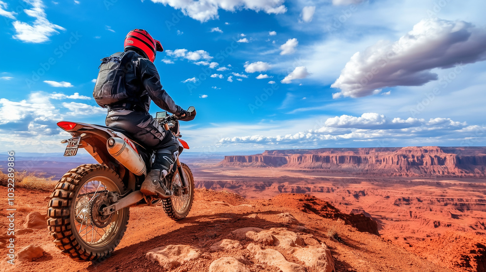 A motorcyclist in full protective gear navigates rough terrain on an off-road motorcycle, gazing at the distant horizon, embodying the spirit of adventure and freedom against a rug A motorcyclist in full protective gear navigates rough terrain on an off-road motorcycle, gazing at the distant horizon, embodying the spirit of adventure and freedom against a rug