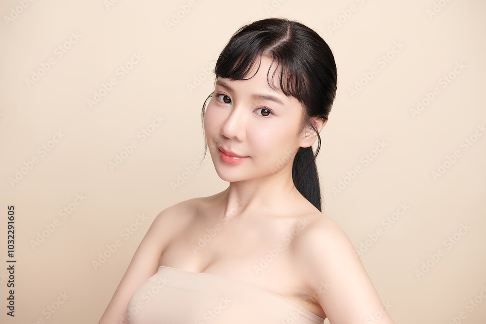Beautiful young asian woman with clean fresh skin on beige background, Face care, Facial treatment, Cosmetology, beauty and spa, Asian women portrait. Beautiful young asian woman with clean fresh skin on beige background, Face care, Facial treatment, Cosmetology, beauty and spa, Asian women portrait.