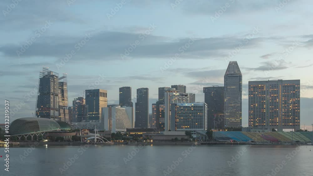 Singapore time lapse city skyline night to day sunrise at Marina Bay waterfront business district Singapore time lapse city skyline night to day sunrise at Marina Bay waterfront business district
