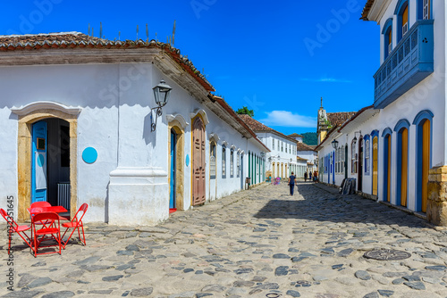 Street with tables of cafe in historical center in Paraty, Rio de Janeiro, Brazil. Paraty is a preserved Portuguese colonial and Brazilian Imperial municipality