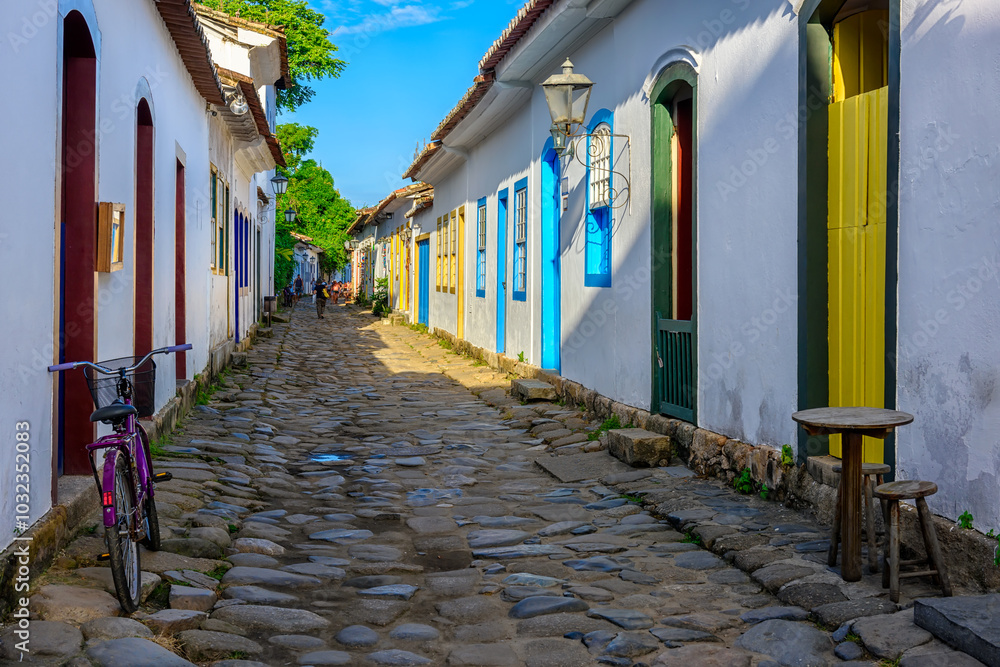 Street with tables of cafe in historical center in Paraty, Rio de Janeiro, Brazil. Paraty is a preserved Portuguese colonial and Brazilian Imperial municipality