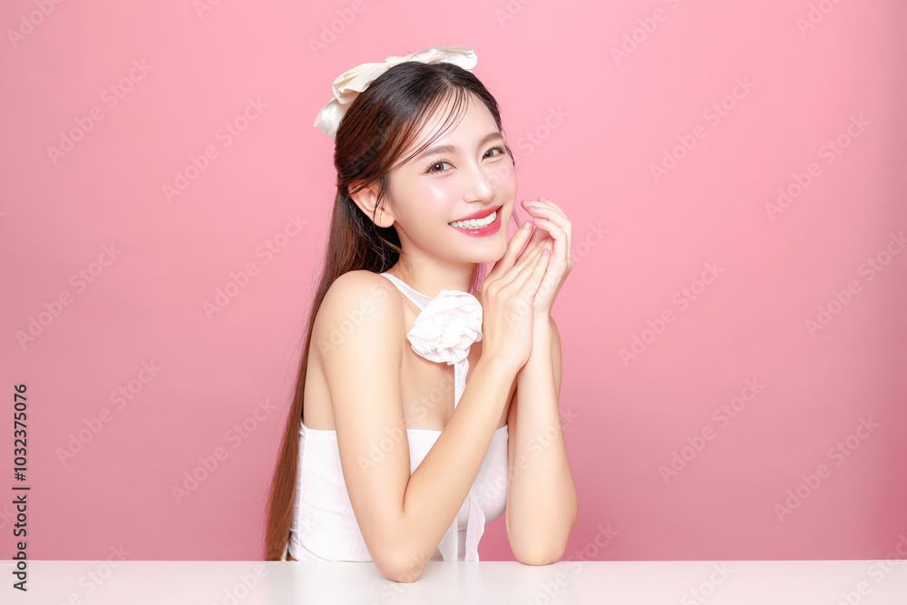 Pretty Asian woman model long hair perfect clear fresh skin smile on isolated pink background. Portrait elegant female beauty blogger make up artist in studio. Skincare, plastic surgery, spa concept. Pretty Asian woman model long hair perfect clear fresh skin smile on isolated pink background. Portrait elegant female beauty blogger make up artist in studio. Skincare, plastic surgery, spa concept.