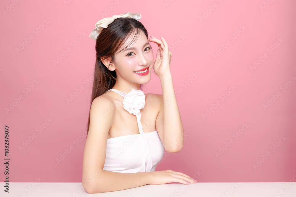 Pretty Asian woman model long hair perfect clear fresh skin smile on isolated pink background. Portrait elegant female beauty blogger make up artist in studio. Skincare, plastic surgery, spa concept. Pretty Asian woman model long hair perfect clear fresh skin smile on isolated pink background. Portrait elegant female beauty blogger make up artist in studio. Skincare, plastic surgery, spa concept.