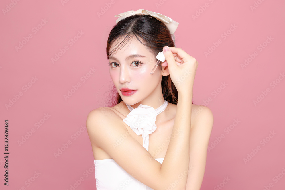 Pretty Asian woman model long hair perfect clear fresh skin smile on isolated pink background. Portrait elegant female beauty blogger make up artist in studio. Skincare, plastic surgery, spa concept. Pretty Asian woman model long hair perfect clear fresh skin smile on isolated pink background. Portrait elegant female beauty blogger make up artist in studio. Skincare, plastic surgery, spa concept.