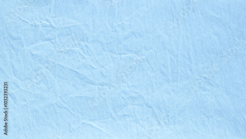 Light blue crumpled paper with macro texture