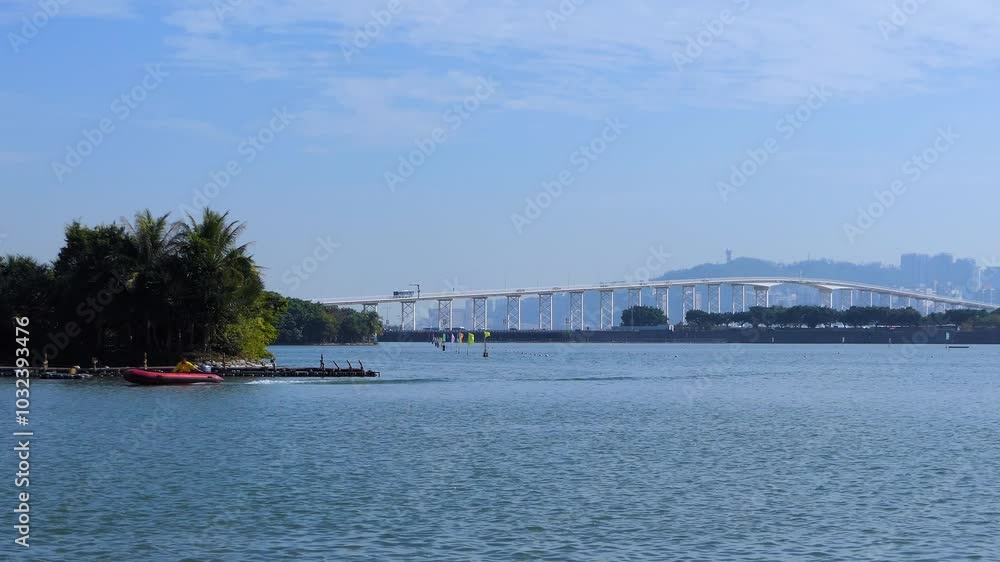 Macau City Shore - Sea Bay Inlet - Hong Kong to Zhuhai 55 km Cable Bridge and Boats - Skyline View - Cloudy Morning Macau City Shore - Sea Bay Inlet - Hong Kong to Zhuhai 55 km Cable Bridge and Boats - Skyline View - Cloudy Morning