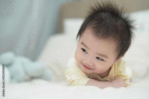 Baby Tummy Time on Soft Cushion with Curious Expression