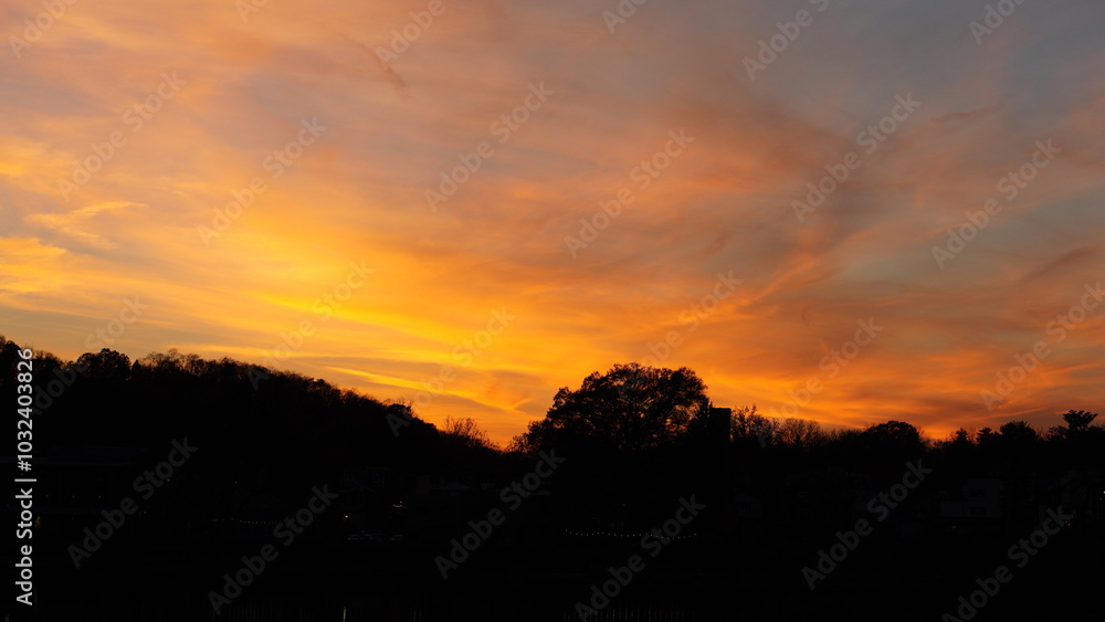 The beautiful sunset sky view with the colorful clouds as background The beautiful sunset sky view with the colorful clouds as background