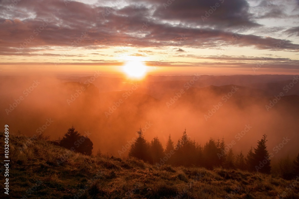 Fototapeta premium sunrise over the mountains, Dochia Chalet, Ceahlau Mountains, Romania 