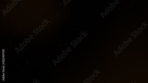 Gold glitter. Golden sparkle confetti. Shiny glittering dust. blurred sparks from fire in front of black background