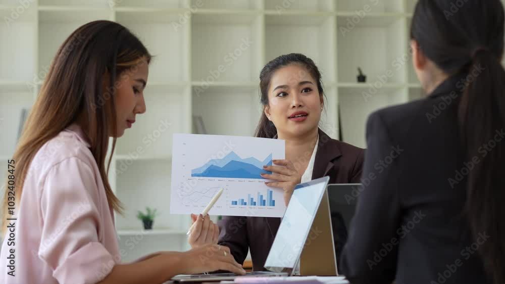Business Meeting Women Collaborating on Financial Graphs and Charts for Modern Analysis and Strategy Business Meeting Women Collaborating on Financial Graphs and Charts for Modern Analysis and Strategy