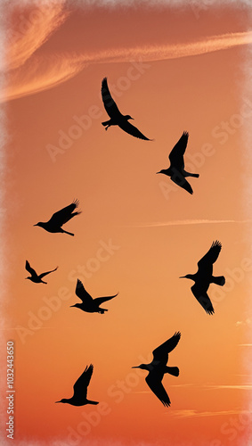 Minimalistic Silhouette of Birds Flying Across Bright Orange Sunset Sky