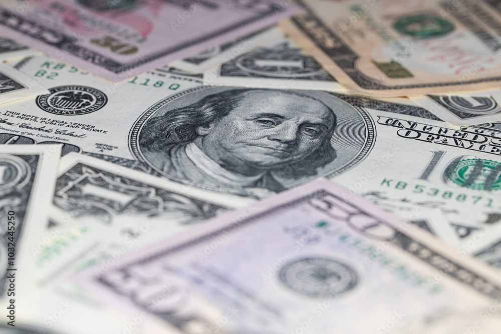 different US dollar banknotes background different US dollar banknotes background