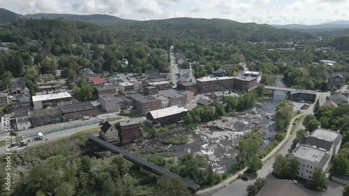 downtown Littleton, and the Ammonoosuc river with a mountain in the background in New Hampshire photo