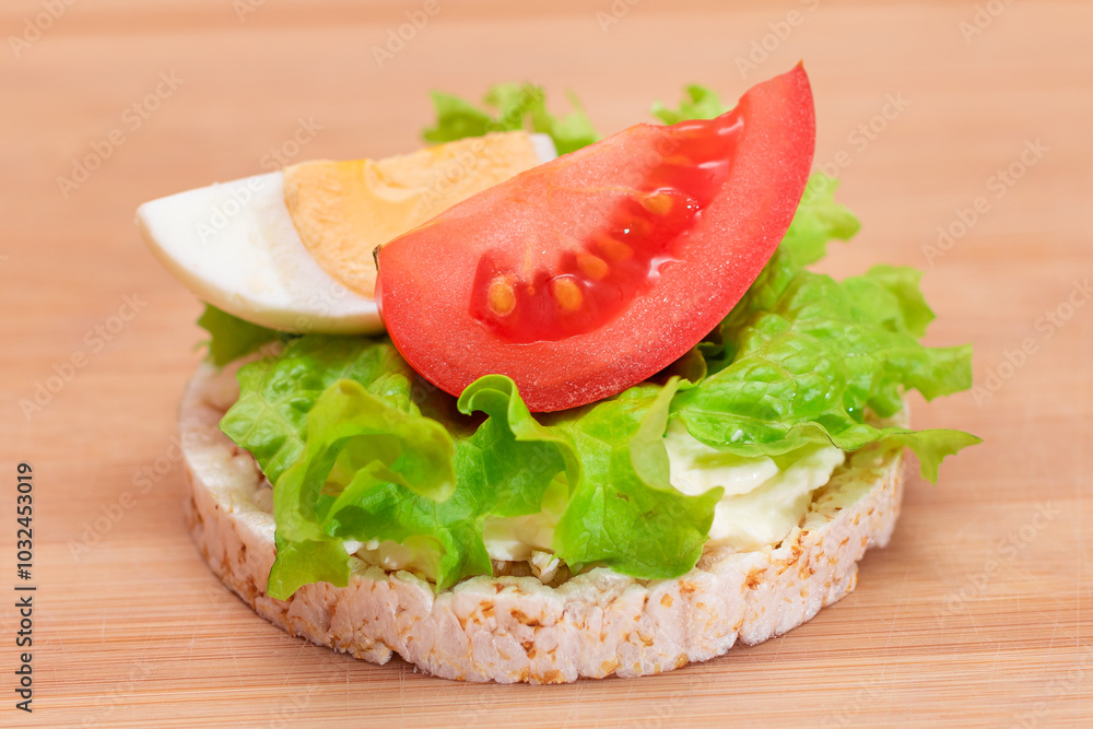 Rice Cake Sandwich with Tomato, Lettuce and Egg on Bamboo Cutting Board. Easy Breakfast. Diet Food. Quick and Healthy Sandwiches. Crispbread with Tasty Filling. Healthy Dietary Snack Rice Cake Sandwich with Tomato, Lettuce and Egg on Bamboo Cutting Board. Easy Breakfast. Diet Food. Quick and Healthy Sandwiches. Crispbread with Tasty Filling. Healthy Dietary Snack