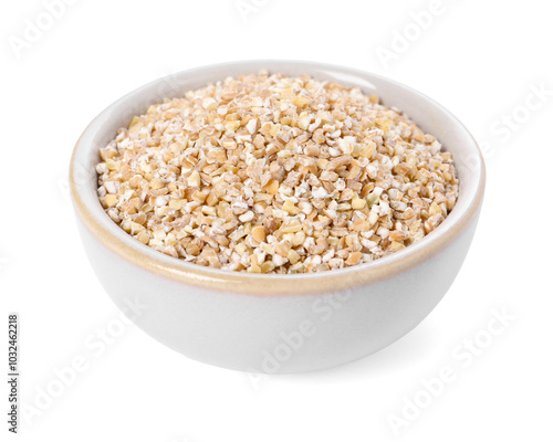 Dry wheat groats in bowl isolated on white