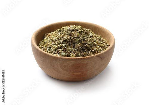 Dried oregano in bowl isolated on white